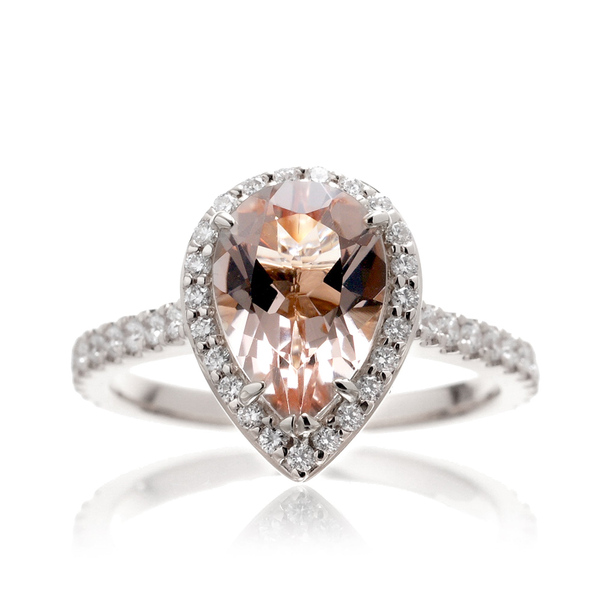 Pear cut morganite ring with diamond halo and band in the Sunset white gold