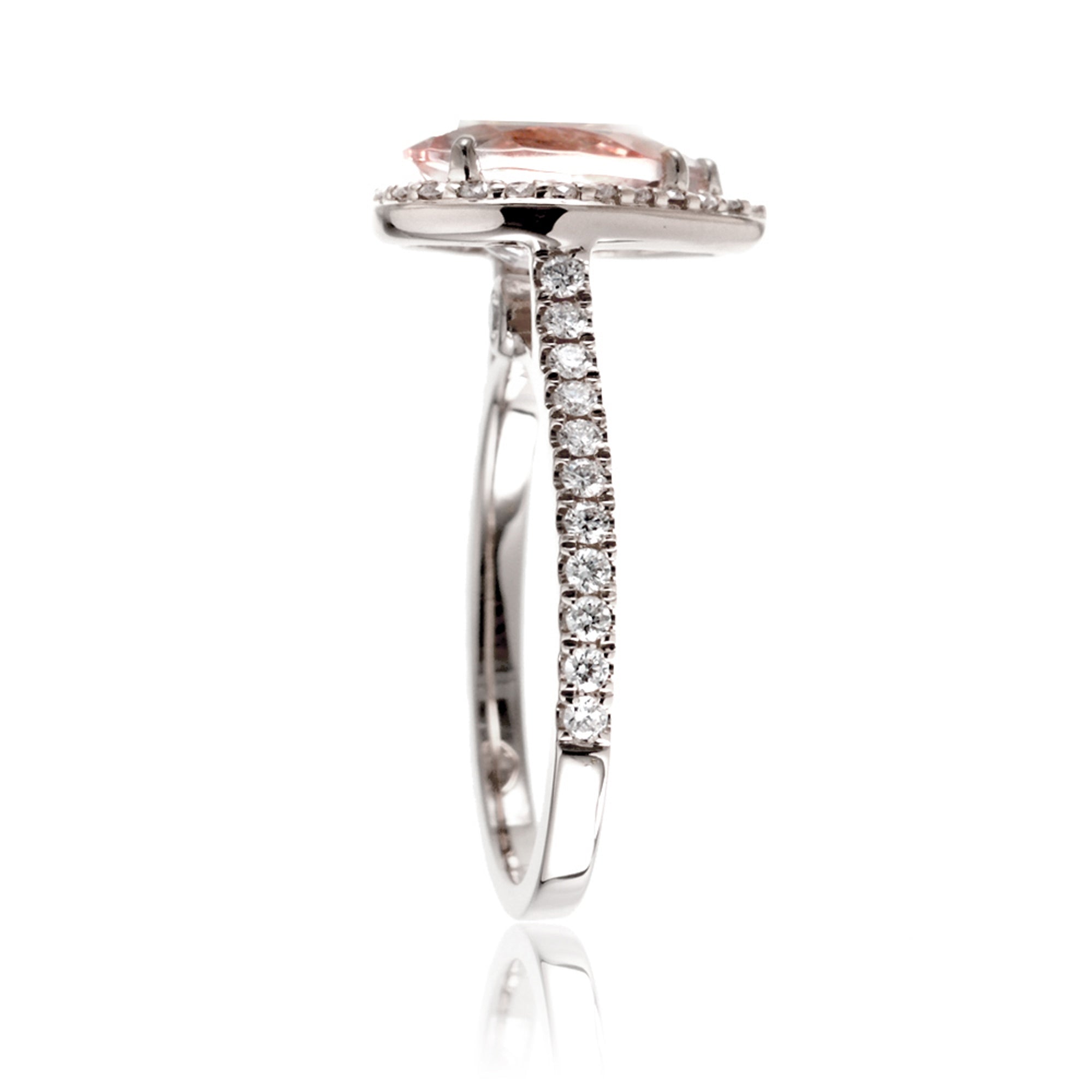 Pear cut morganite ring with diamond halo and band in the Sunset white gold