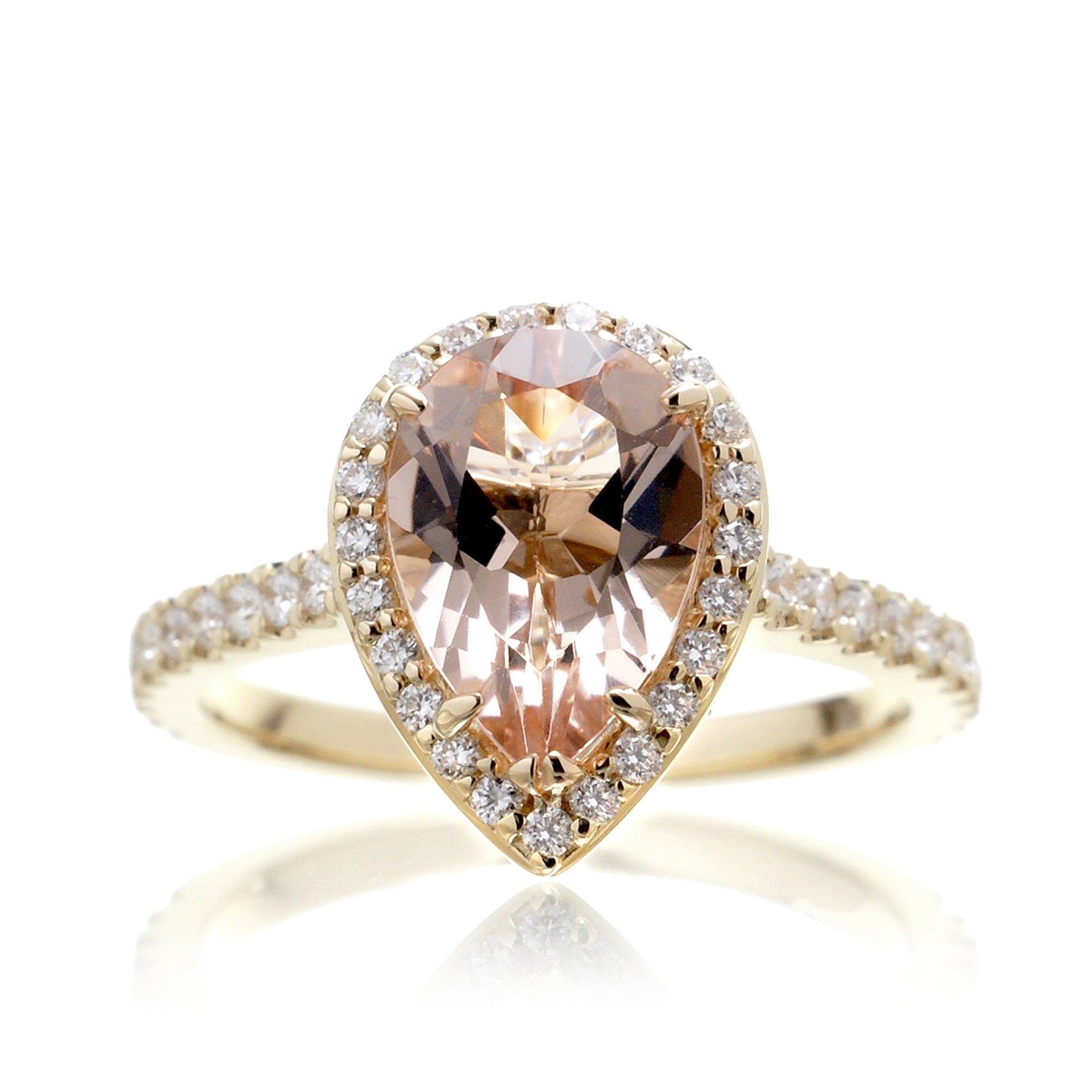 Pear cut morganite ring with diamond halo and band in the Sunset yellow gold
