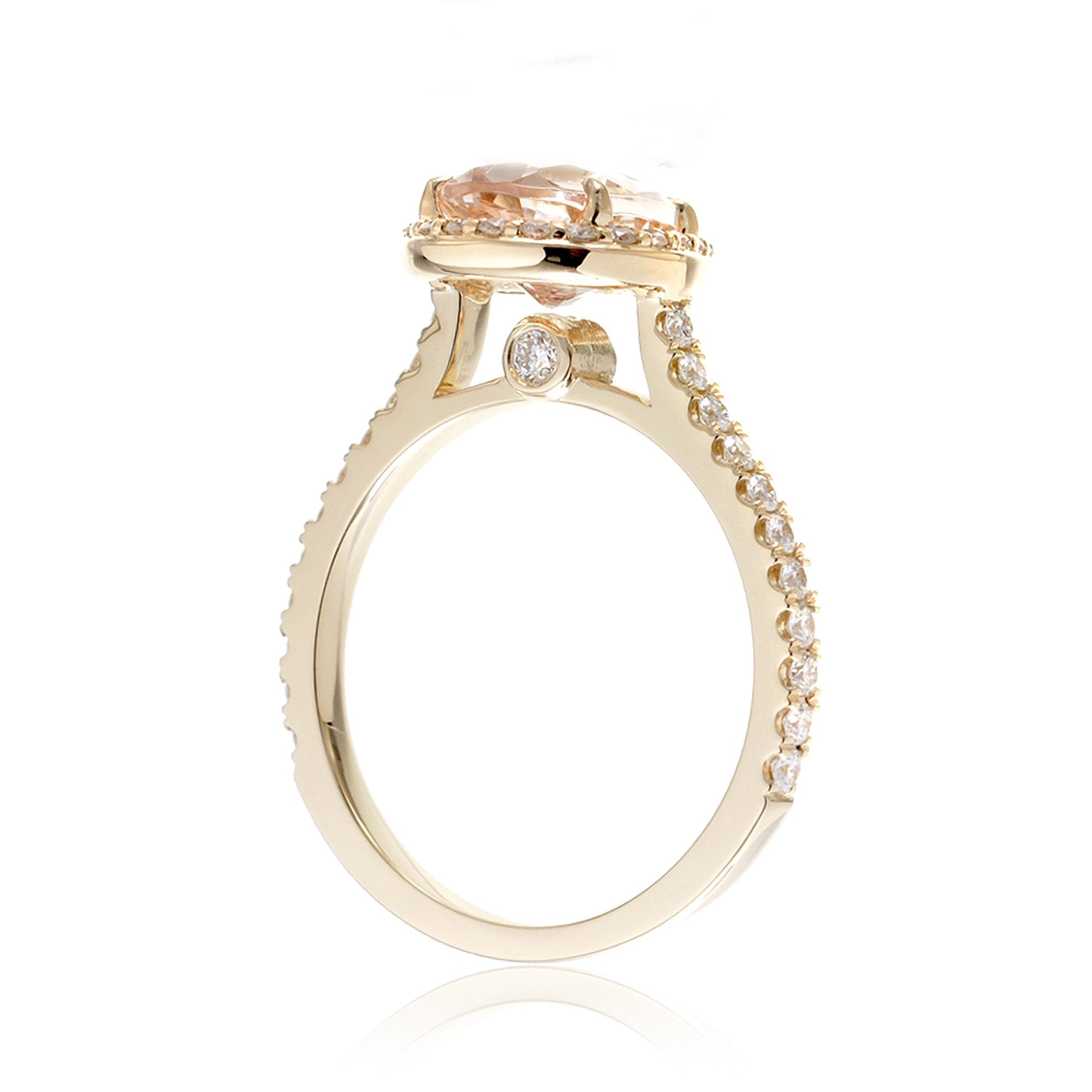 Pear cut morganite ring with diamond halo and band in the Sunset yellow gold
