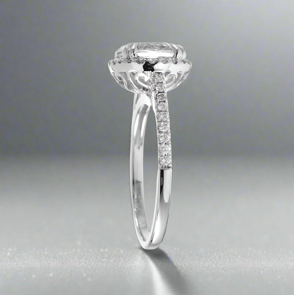 Round diamond engagement ring with halo in white gold