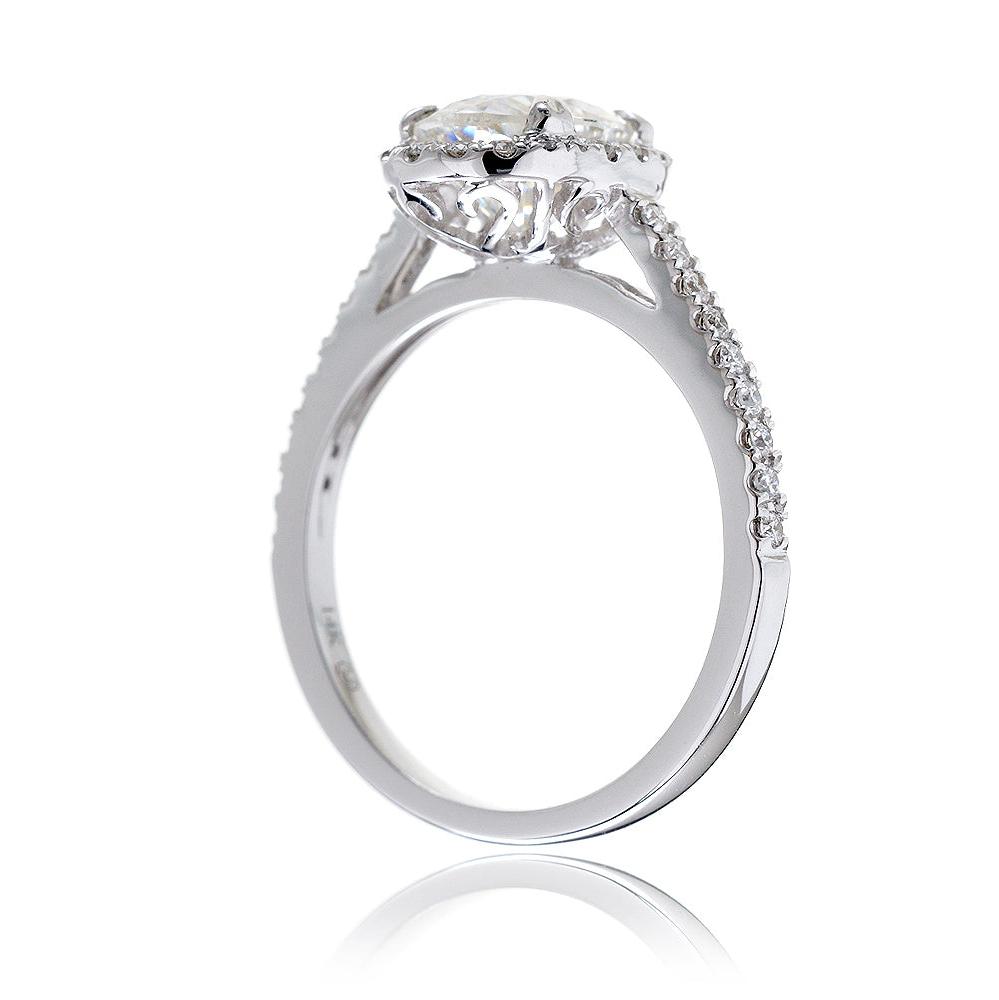 Oval cut moissanite engagement ring with a diamond halo in white gold