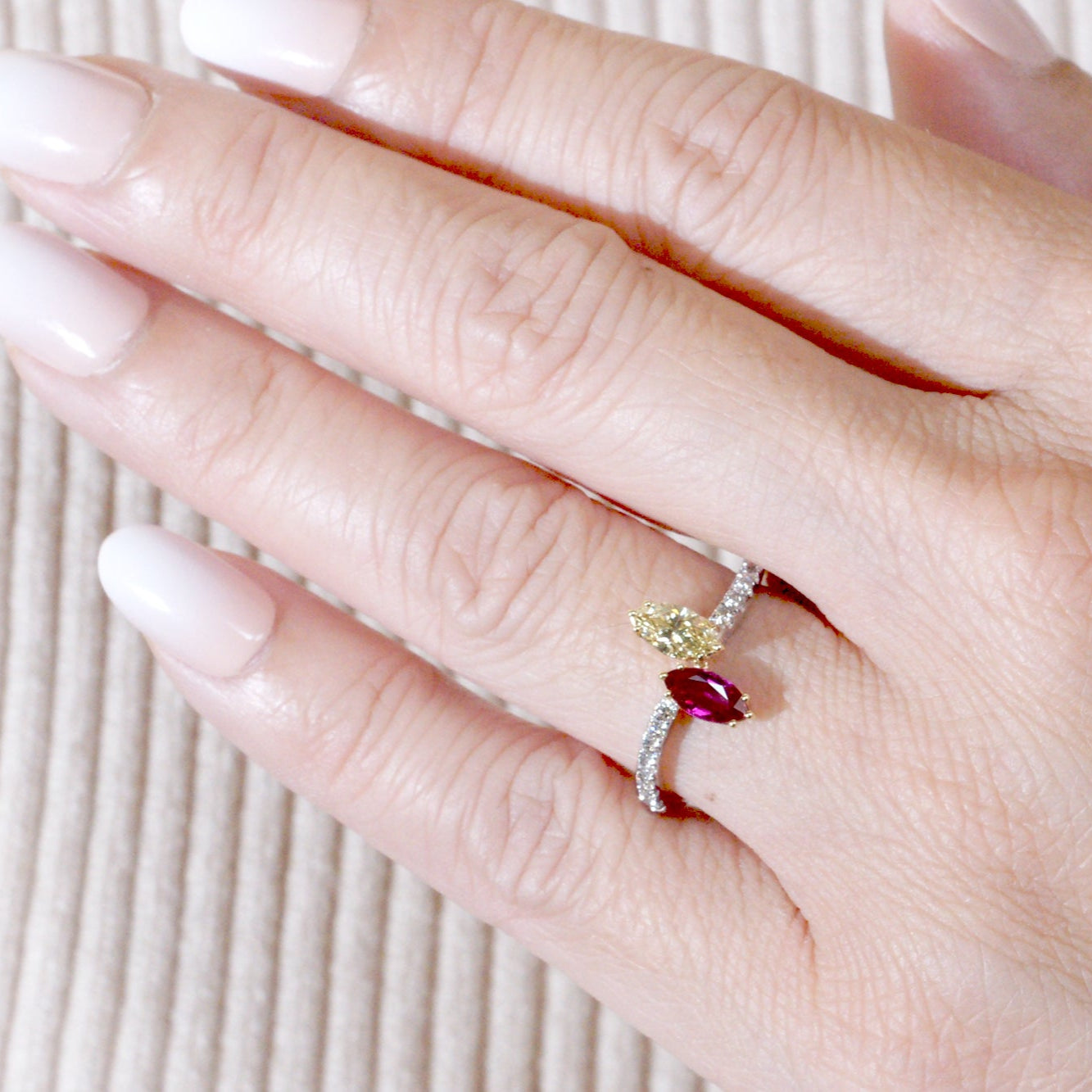 Toi et moi marquise diamond and ruby wave ring in white gold