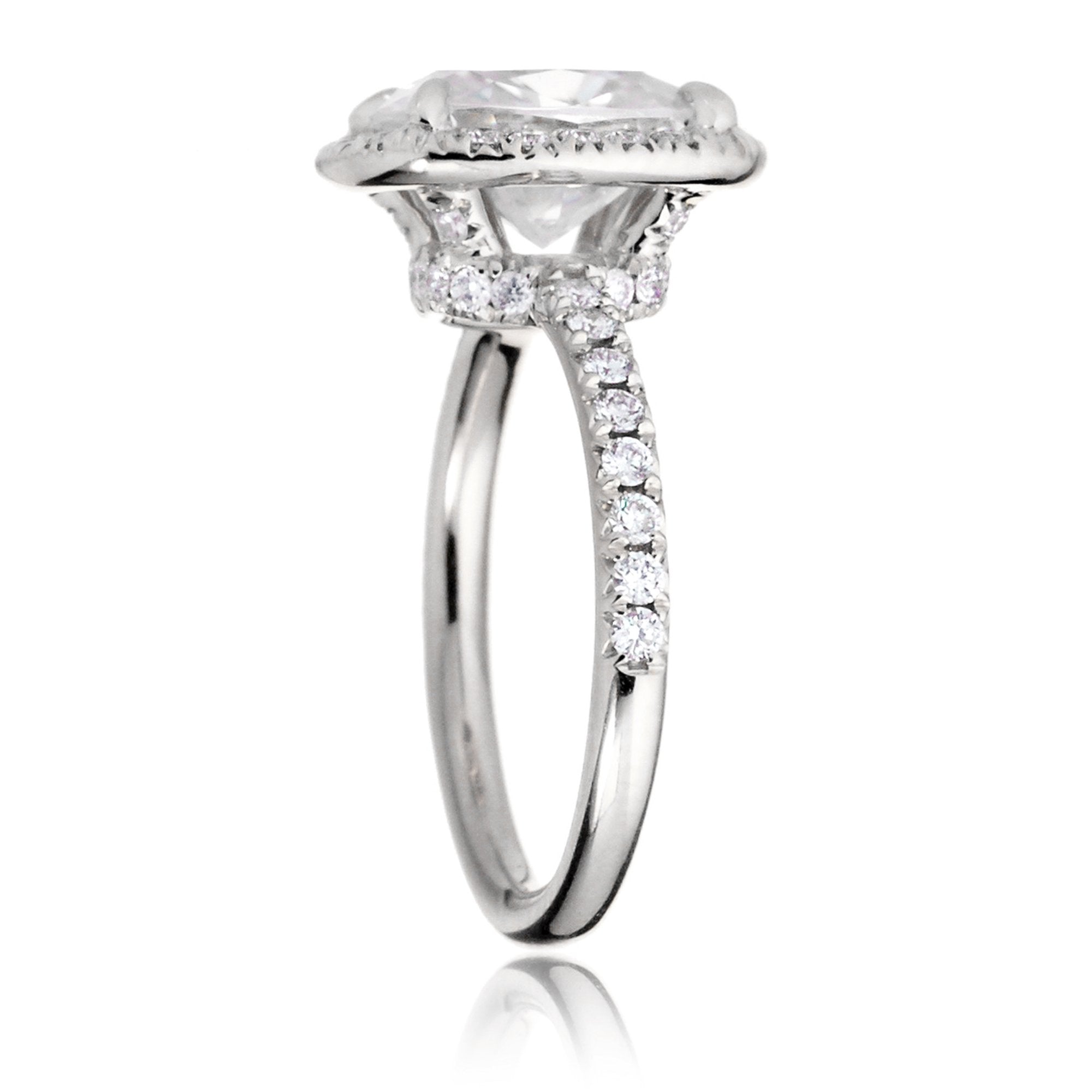 Cushion moissanite and diamond halo ring with a diamond band in white gold - the drenched