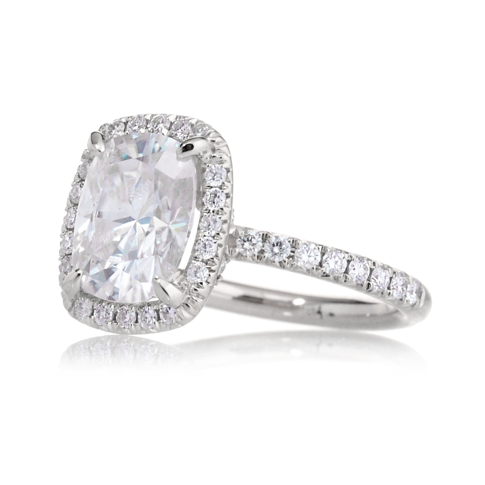 Cushion moissanite and diamond halo ring with a diamond band in white gold - the drenched