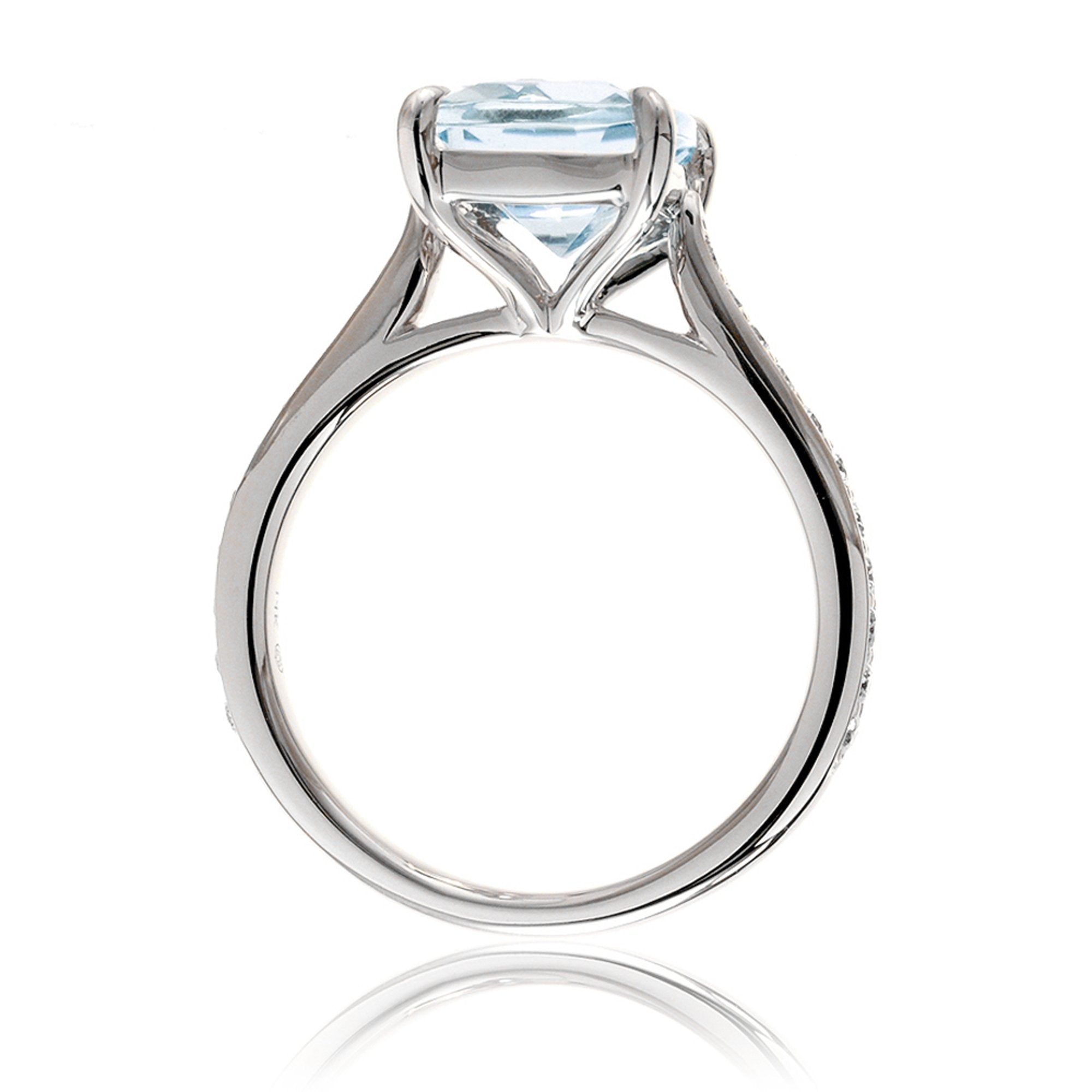 Cushion aquamarine ring with a diamond band cathedral setting white gold