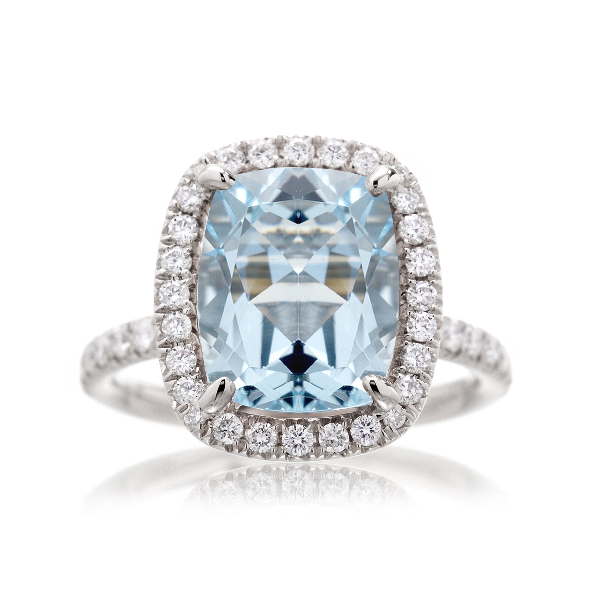 Cushion cut aquamarine ring with a diamond halo and comfort fit band the Drenched white gold