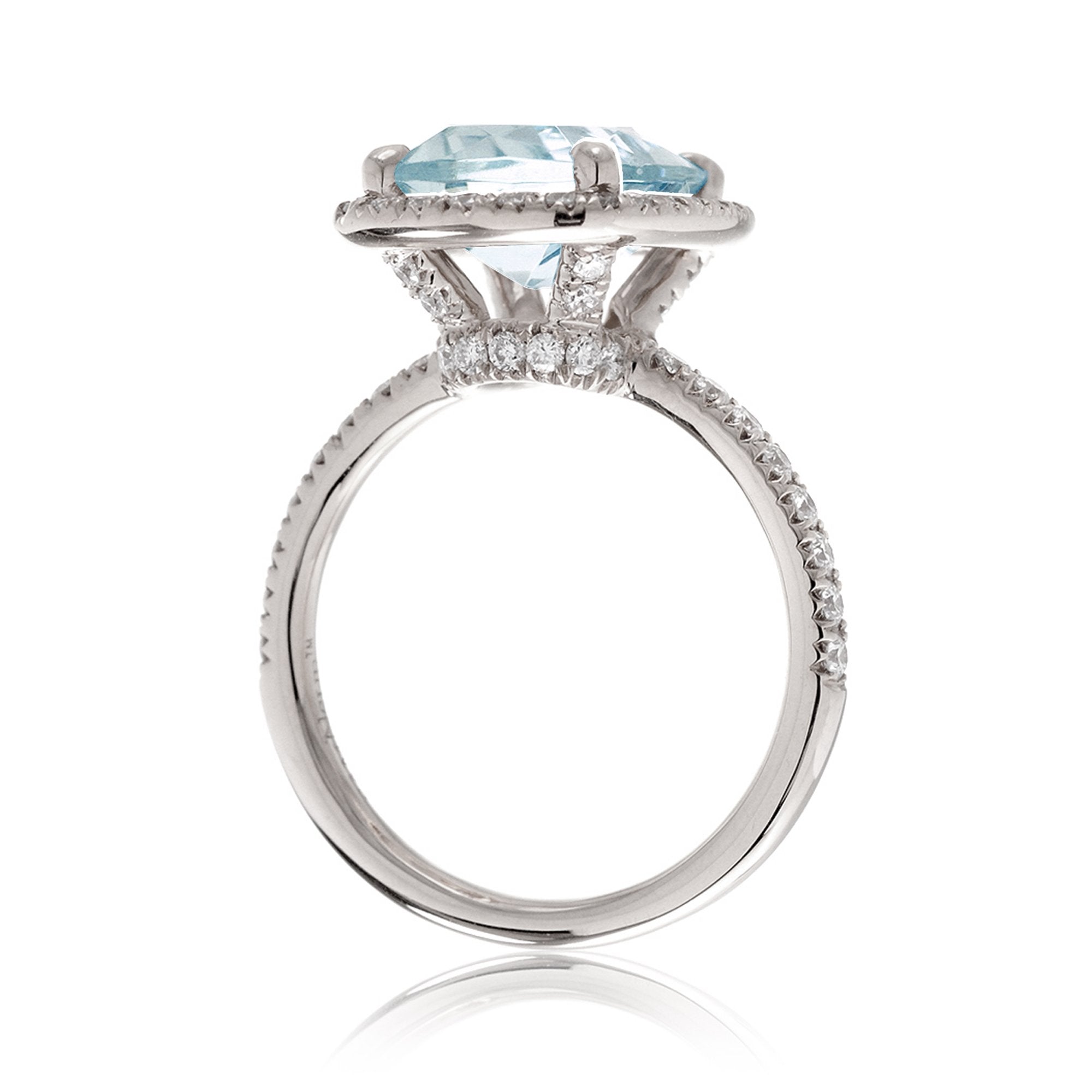 Cushion cut aquamarine ring with a diamond halo and comfort fit band the Drenched white gold side view