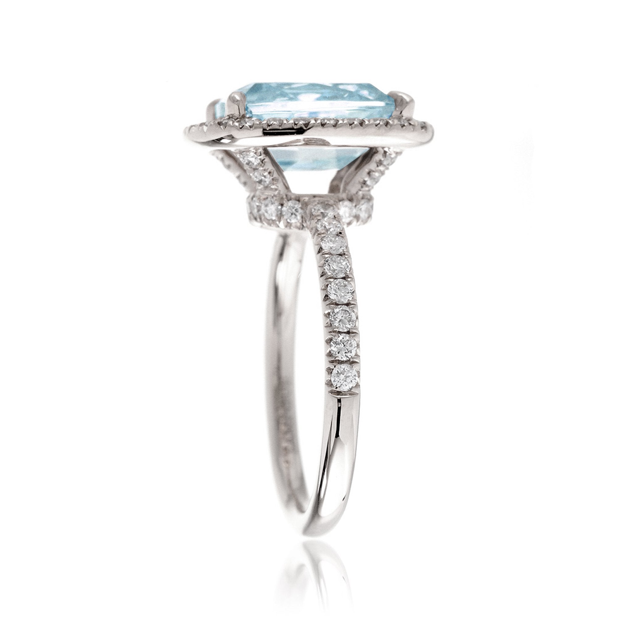 Cushion cut aquamarine ring with a diamond halo and comfort fit band the Drenched white gold side profile