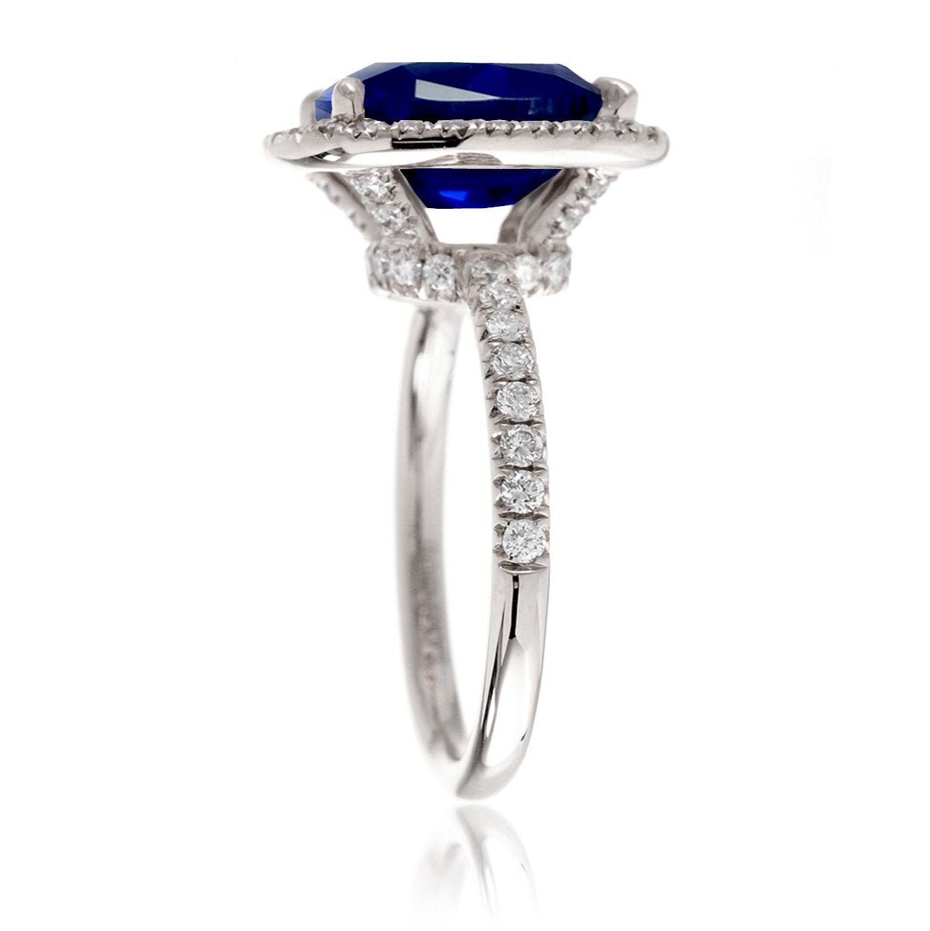 Blue sapphire ring with diamond halo The Drenched engagement white gold profile view