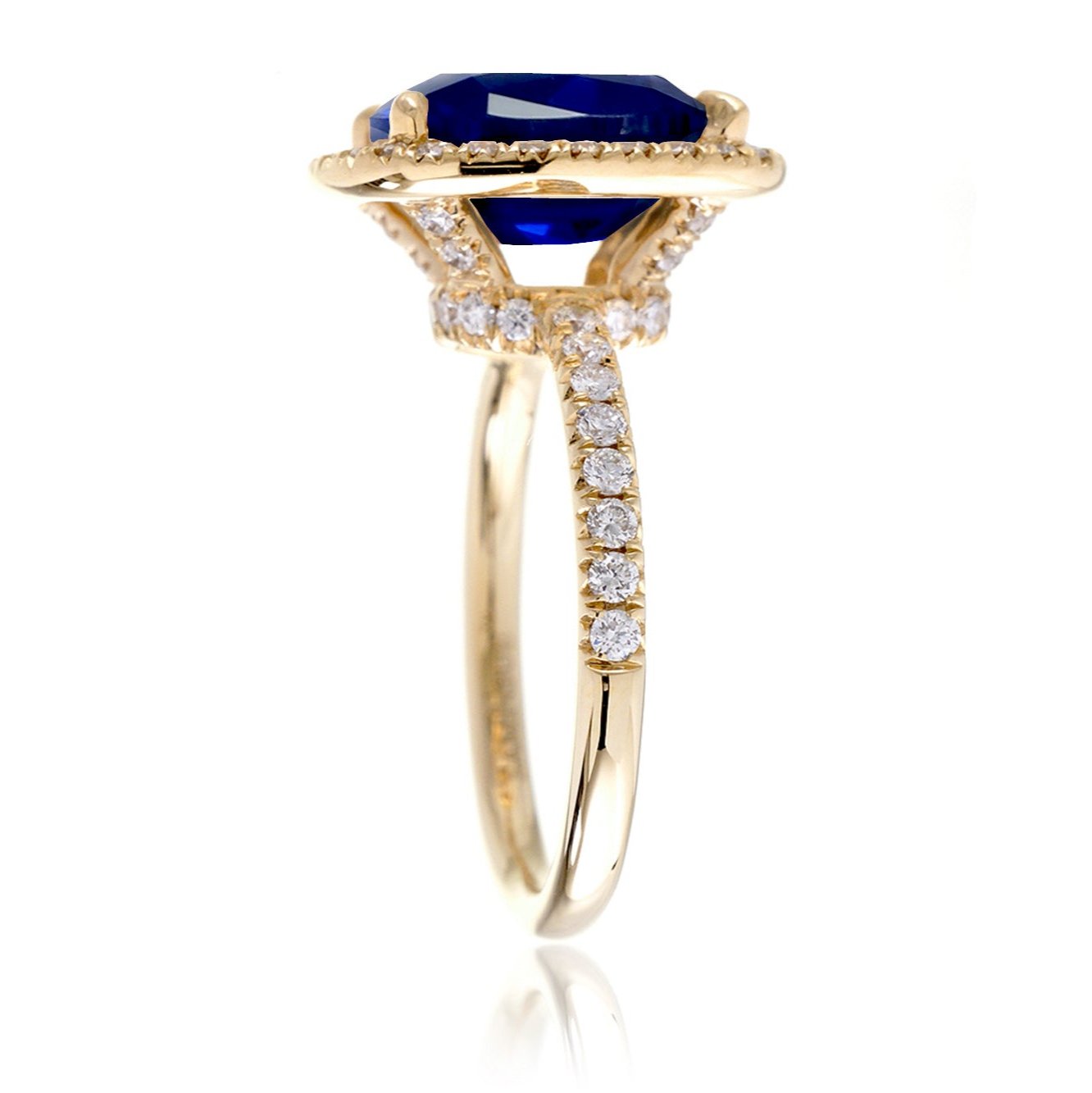 Blue sapphire ring with diamond halo The Drenched engagement yellow gold profile view