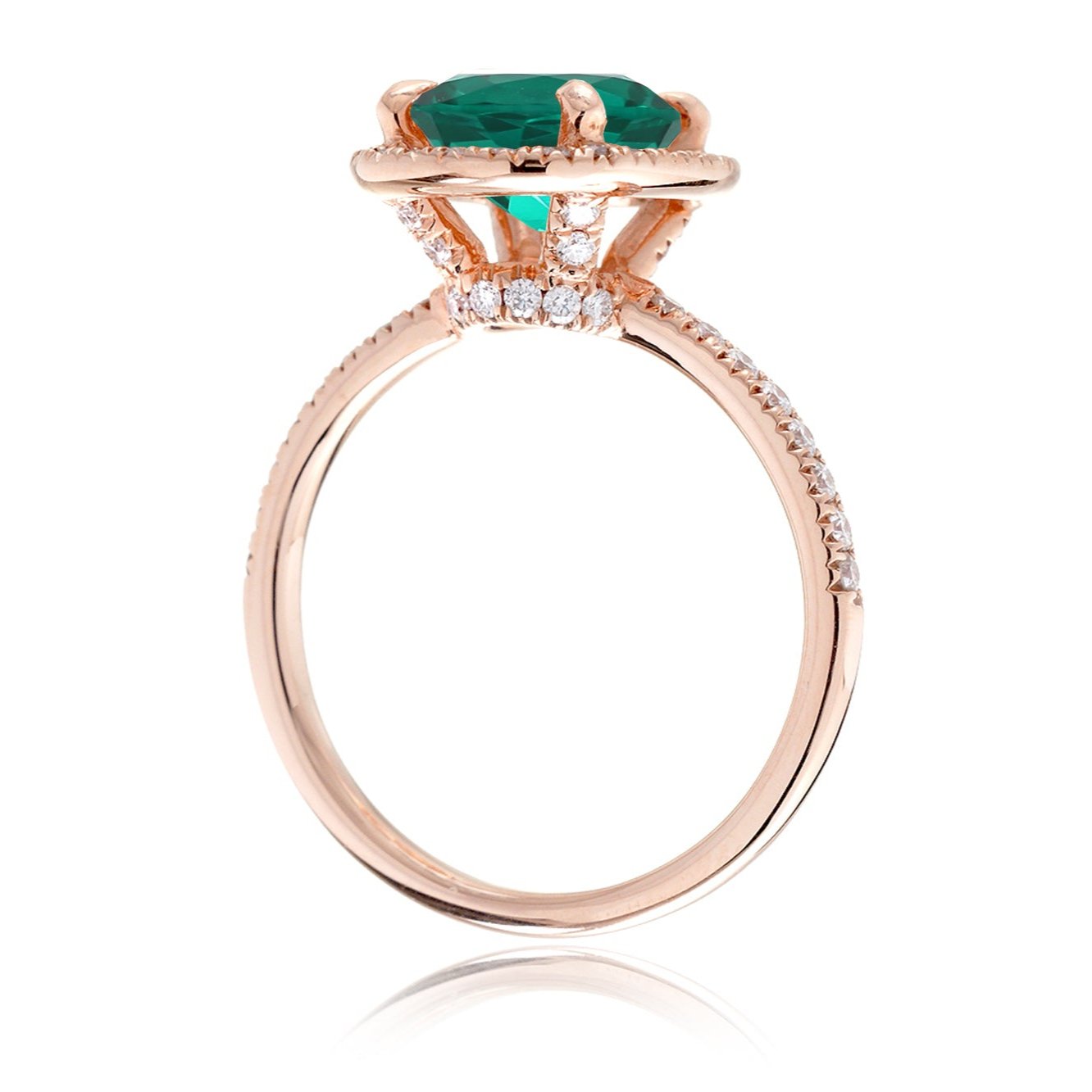 Oval cut emerald engagement ring with diamond halo the Drenched rose gold side view