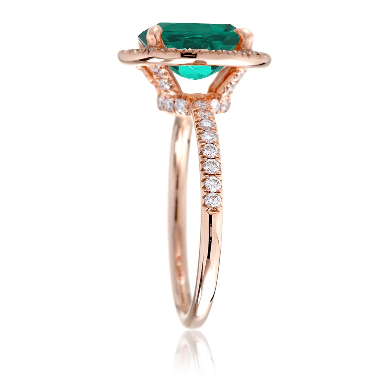 Oval cut emerald engagement ring with diamond halo the Drenched rose gold profile view