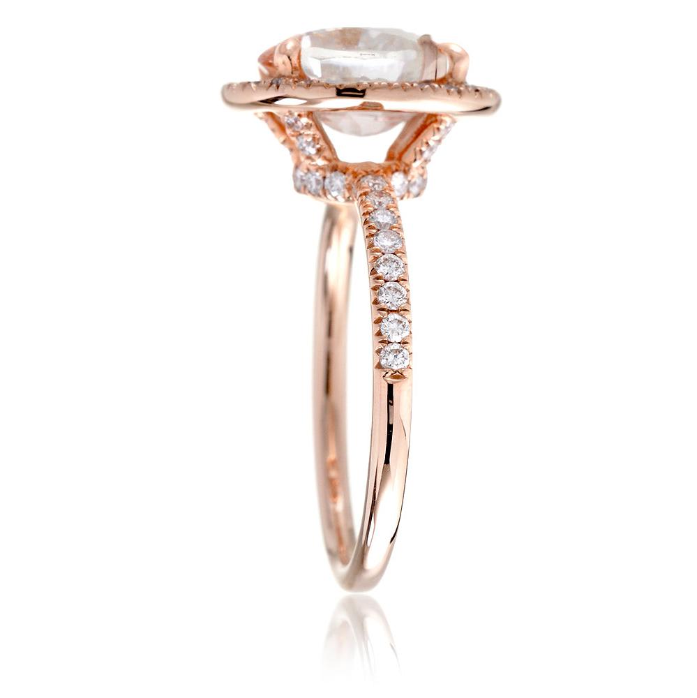 Oval moissanite cut engagement ring with diamond halo the Drenched rose gold profile view