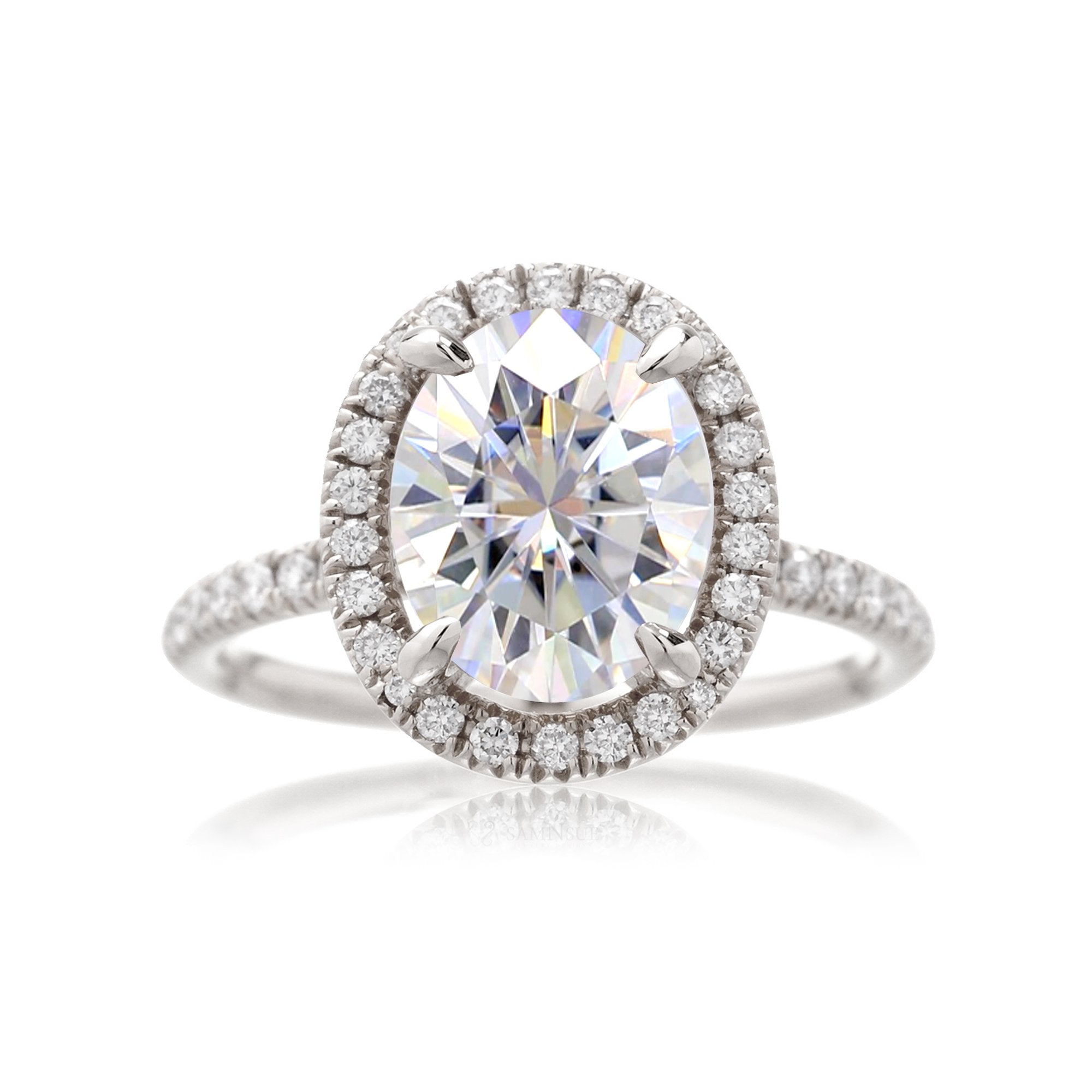 Oval moissanite cut engagement ring with diamond halo the Drenched white gold