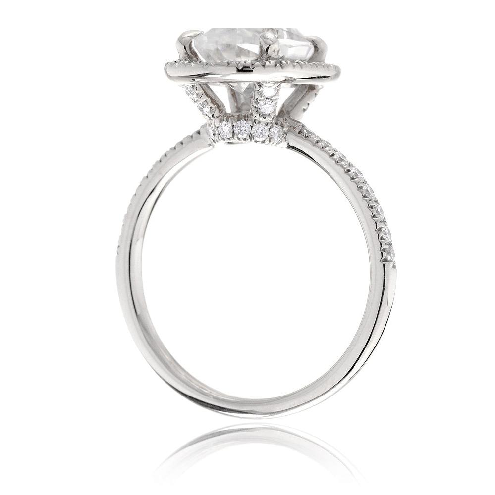 Oval moissanite cut engagement ring with diamond halo the Drenched white gold side view