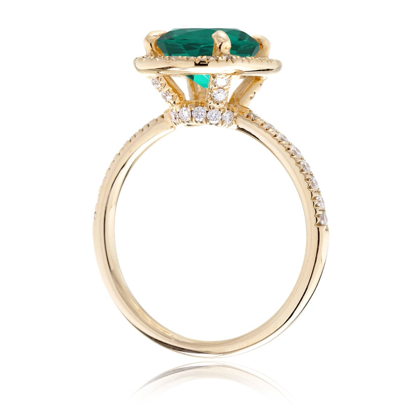 Oval cut emerald engagement ring with diamond halo the Drenched yellow gold side view