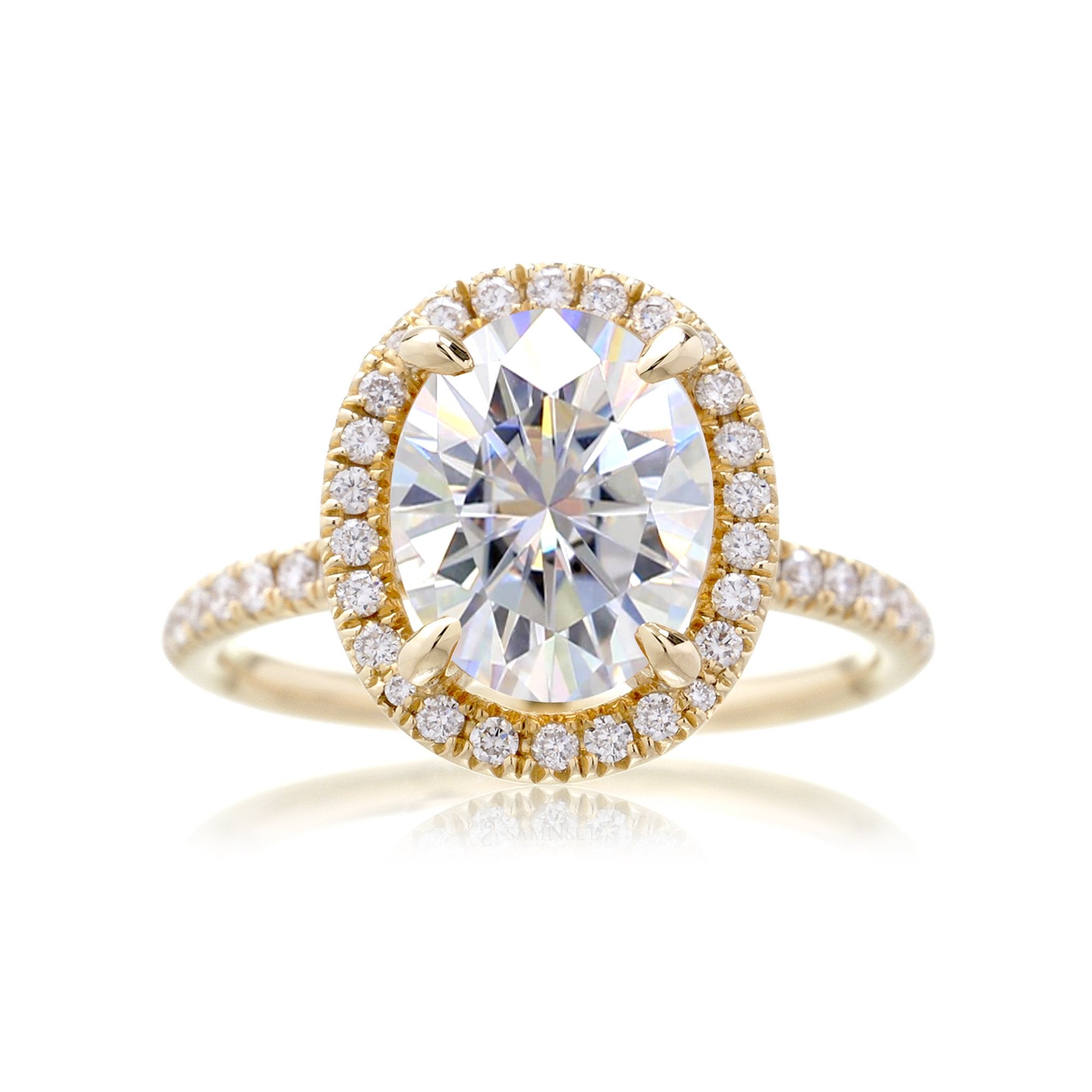 Oval moissanite cut engagement ring with diamond halo the Drenched yellow gold