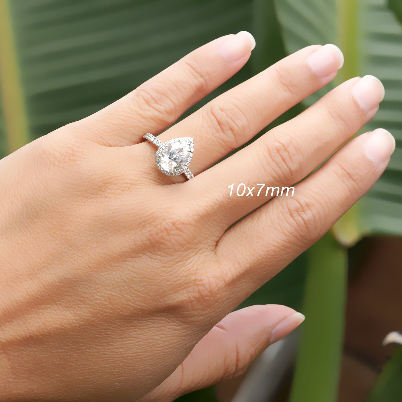 Pear moissanite ring with diamond halo in white gold