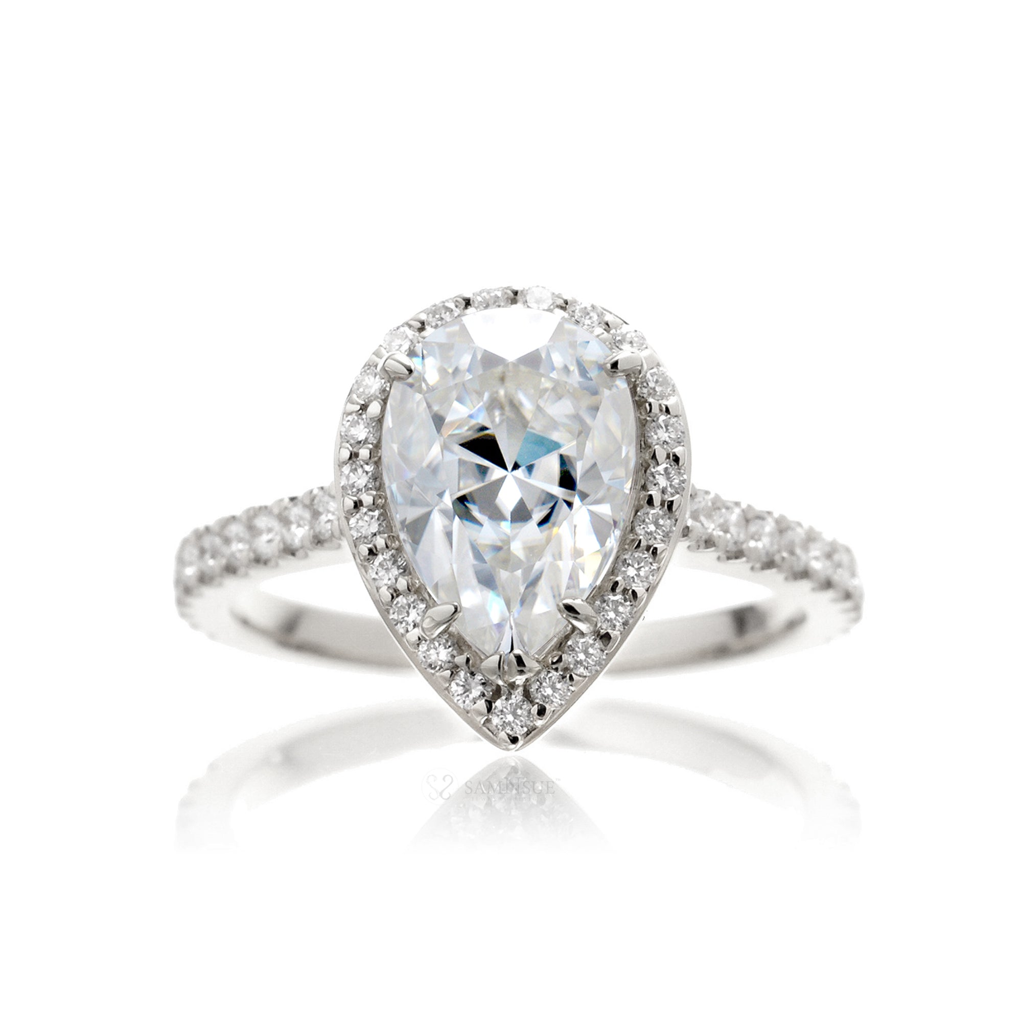 Pear moissanite engagement ring with a diamond halo in the sunset white gold